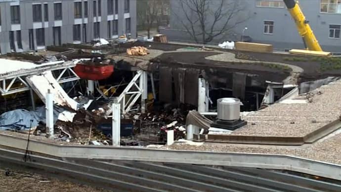 a roof garden can clearly be seen under construction on the roof of the mall in Riga, Latvia